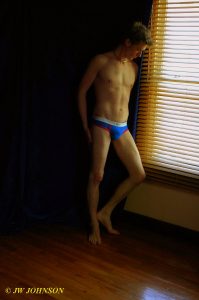 briefs boy gazes out window